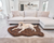 Labrador retriever dog resting on brown faux fur bed