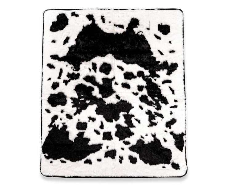 black cowhide blanket on isolated white blanket