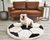 bulldog on soccer ball faux fur dog bed in front of brown leather couch