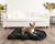 french bulldog on small black faux fur dog bed 